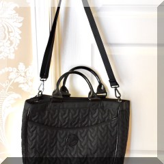 H22. Vera Bradley quilted black handbag.